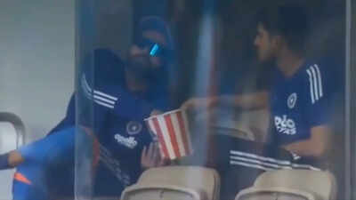 Rohit Sharma and Shubman Gill caught munching popcorn during rain delay – WATCH | Cricket News Rohit Sharma and Shubman Gill caught munching popcorn during rain delay – WATCH | Cricket News